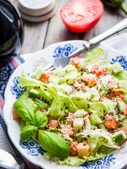 green vegetable salad with tomato, eggplant, sesame seeds and ba