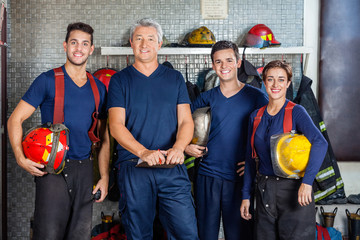 Obraz premium Confident Firefighters Standing At Fire Station