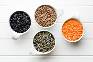 various lentils in ceramics bowls