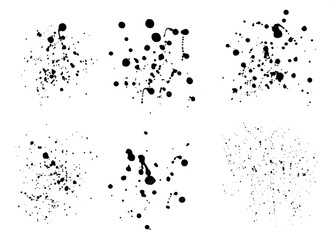 Black ink spray drops isolated on white background.