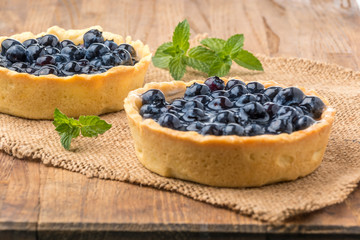 fresh blueberries homemade tart on a wooden desk