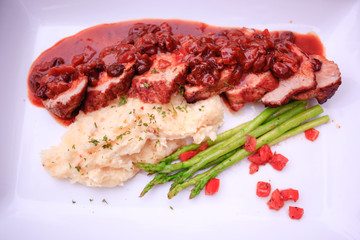 meat table with fried beef, asparagus served  and potatoes mash