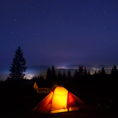 Illuminated orange camping tent