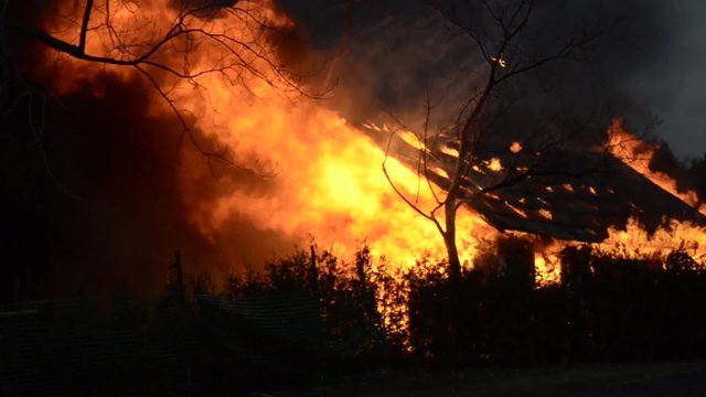 Old Barn on Fire with Huge Flames