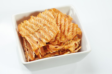 Dry squid in white bowl