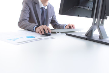 Businessman analyzing investment charts with computer. Accountin