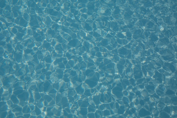 Abstract background with blue radial water ripples