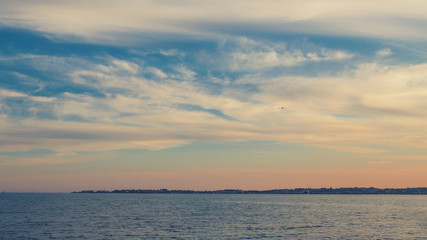 Beautiful cloudscape and the sea, with retro colors