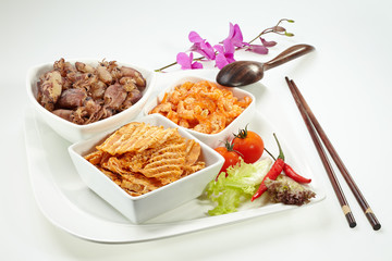Mixed dry shrimp and squid set in white plate