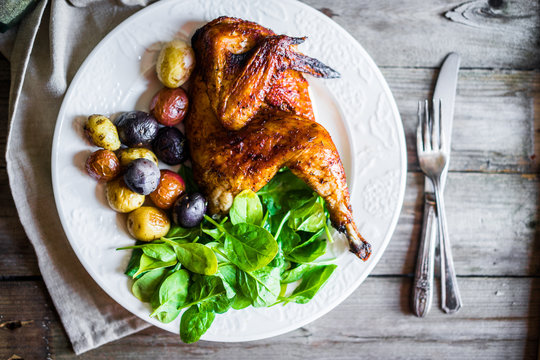 Roasted Half Chicken With Potatoes And Spinach