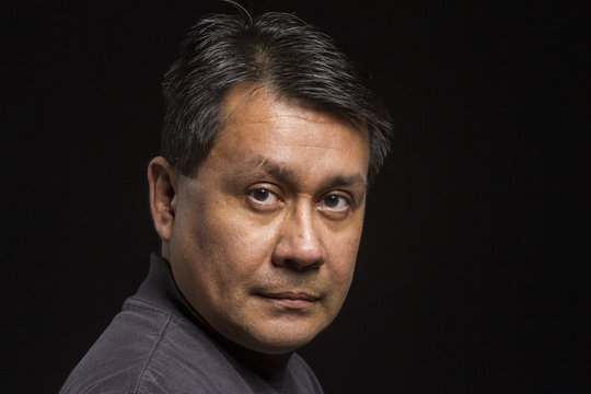 Studio Portrait Of A Serious Hispanic Male