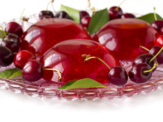 Summer refreshing dessert - red berries jelly with cherries
