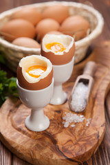 Boiled eggs on a wooden background