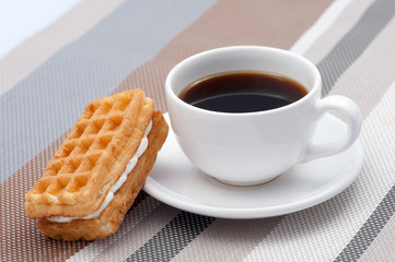 Obraz na płótnie Canvas Waffle and a Cup of hot coffee