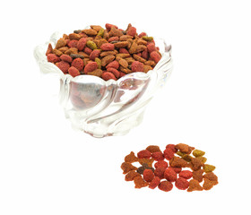 Generic dry cat food in glass bowl with spill