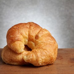 croissant bakery on teakwood table