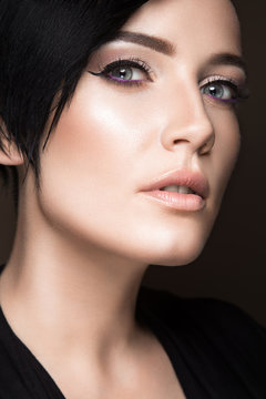  Preview
Stock Photo:
Beautiful brunette girl with evening make-up and perfect skin. Beauty face. Picture taken in the studio on a black background.