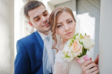 Close up portrait of gentle newlyweds