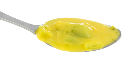 Spoonful of broccoli and cheddar cheese soup
