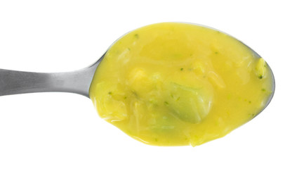 Spoonful of cheddar cheese and broccoli soup