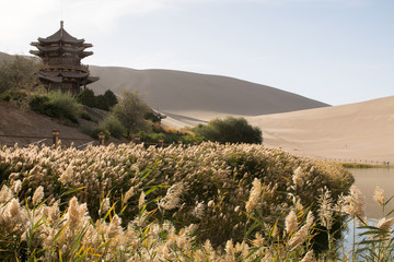 Chinese pavilion near Crescent Moon Lake in desert, Dunhuang, Ch