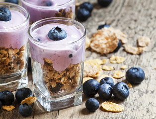 Healthy breakfast of whole grain cereal, muesli and blueberries