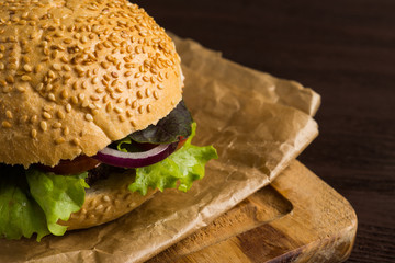 Burgers on the wooden background