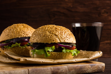 Burgers on the wooden background