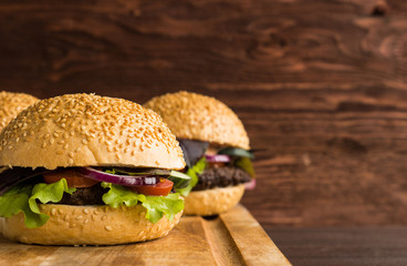 Burgers on the wooden background