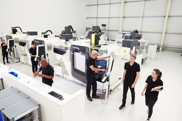 Fototapeta premium High Angle View Of Engineering Workshop With CNC Machines