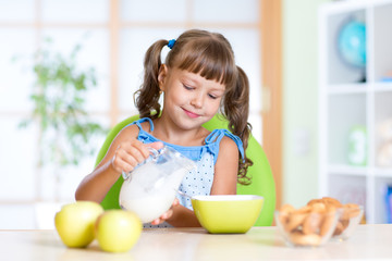 child eating healthy food at home