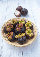 Mangosteen in round rattan basket vertical style