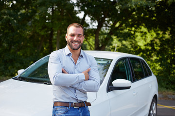 Happy man with car