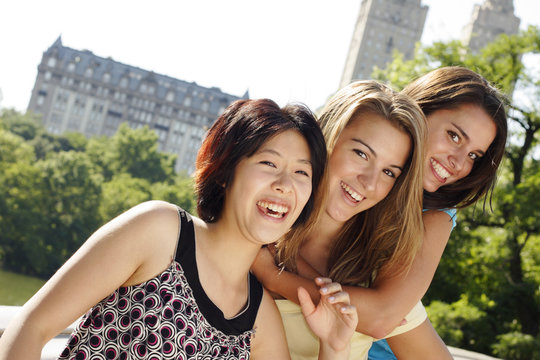 Three friends two piggyback having enormus fun!