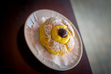 cream puff with black cherry