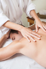 Obraz na płótnie Canvas Man back laid receiving massage