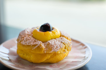 cream puff with black cherry