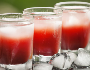 number of glasses of red cocktails on the veranda of a cafe on a