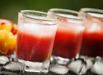 number of glasses of red cocktails on the veranda of a cafe on a