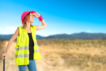 Work woman with ax over white background