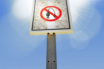 forbidden fishing or not not fish sign on wooden pole prohibited signal under blue sky