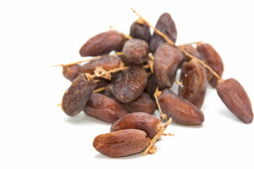 close up of dried dates  on white background