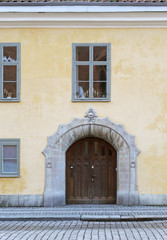 Fototapeta na wymiar The wooden door in the center of Vasteras city in Sweden