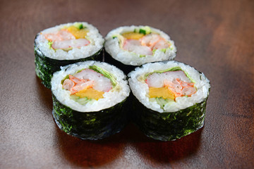 Sushis on wooden background