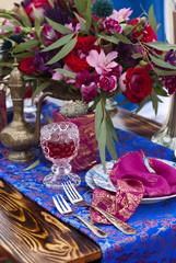 Wedding table arrangement in desert sand of Morocco stile