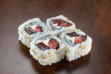 Sushis on wooden background