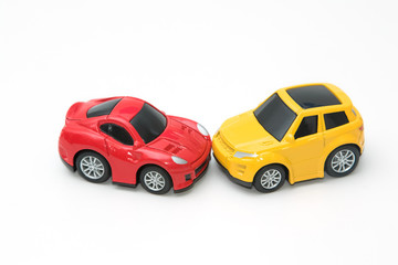 Toy cars in accident on a white background ,concept safety car