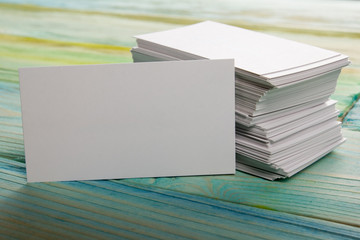 White blank corporate identity business visit card on wooden background