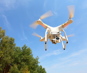 Drone quadrocopter with high resolution digital camera. New tool for aerial photo and video.