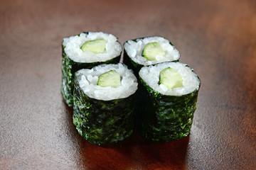 Sushis on wooden background